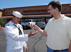 Man giving keys to a navy officer